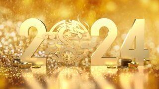 金色の背景に2024年の文字と竜のシンボル